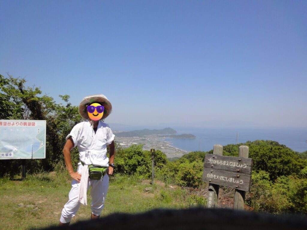 Me in walking pilgrim attire at the Osaka Pass Observatory on the return pilgrimage route