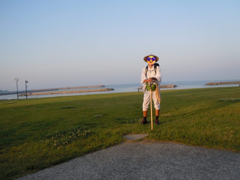 Walking pilgrim standing on the lawn at Yasu Roadside Station