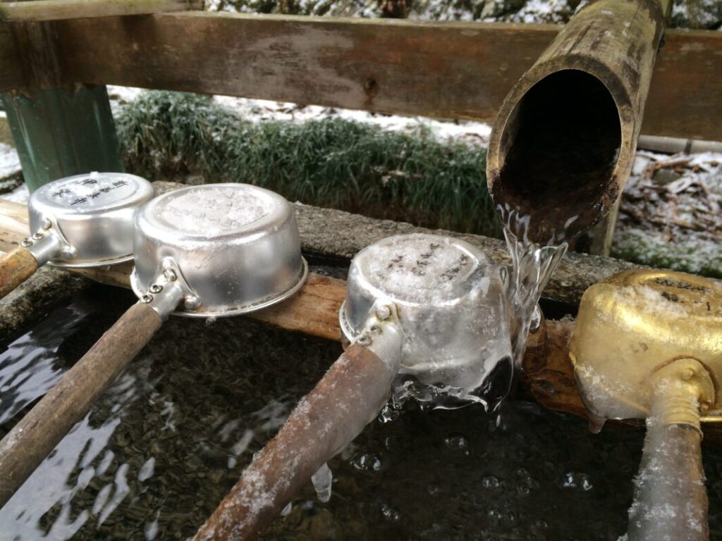 Frozen purification basin at Yokomineji Temple